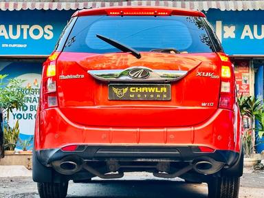 Mahindra XUV W10 with sunroof push model 2015 running 83k DL number