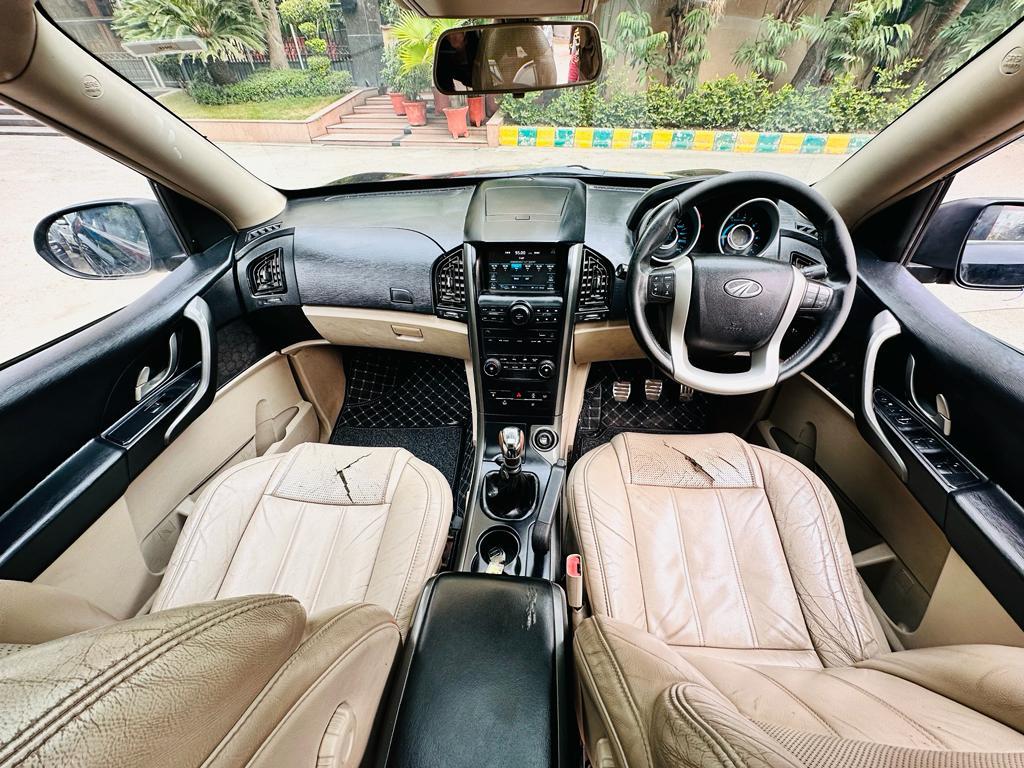 Mahindra XUV W10 with sunroof push model 2015 running 70k HR number