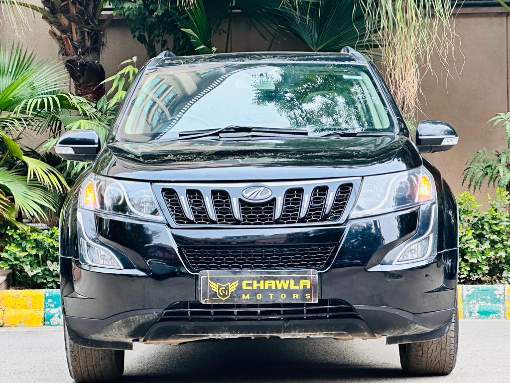 Mahindra XUV W10 with sunroof push model 2015 running 70k HR number