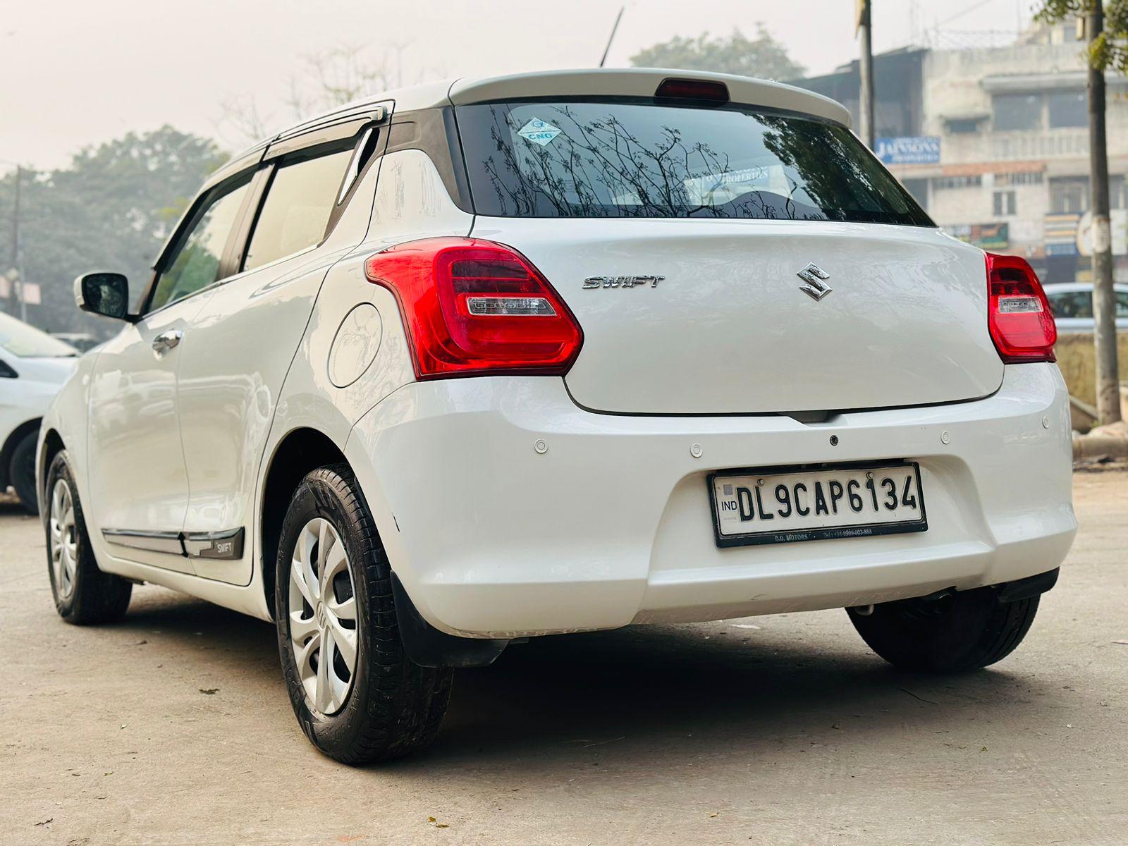 Maruti Swift vxi petrol CNG model 2018 running 73k DL number