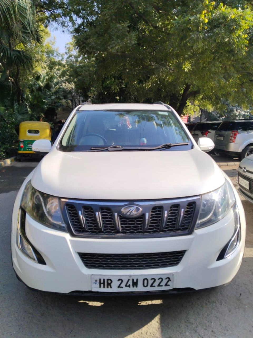 Mahindra XUV W10 with sunroof push model 2016 running 72k HR number