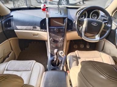 Mahindra XUV W10 with sunroof push model 2016 running 72k HR number