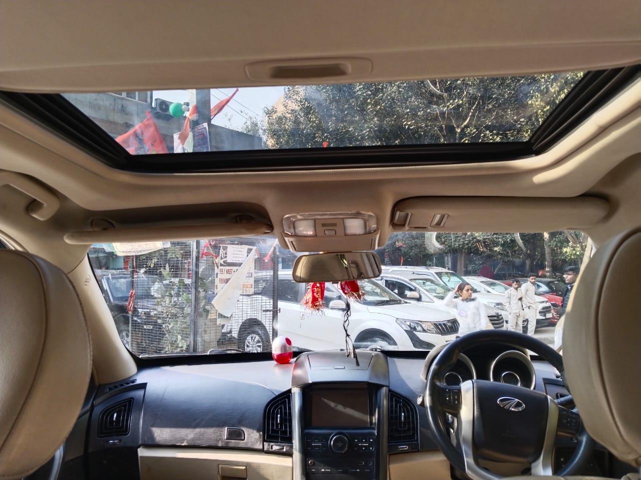 Mahindra XUV W10 with sunroof push model 2016 running 72k HR number