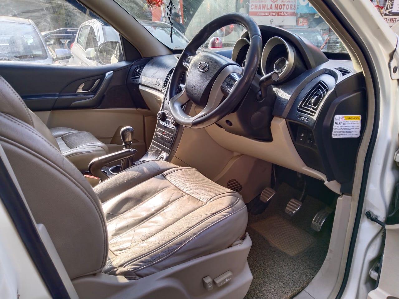 Mahindra XUV W10 with sunroof push model 2016 running 72k HR number